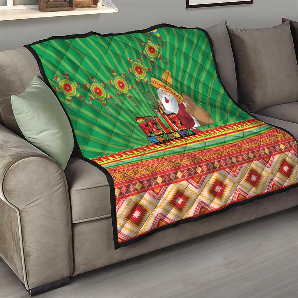 Green Feliz Navidad quilt draped on sofa, showing aztec stripes and Santa figure