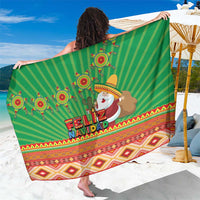 Green Christmas sarong with Feliz Navidad print, Santa face, and striped Aztec border