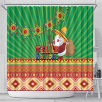 Green shower curtain showing Feliz Navidad text, Santa figure, and striped Aztec pattern