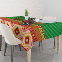 Green tablecloth with southwestern diamond and striped pattern, multicolor trim