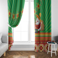 Green “Feliz Navidad” window curtain panels with striped fabric and Aztec border in reds.