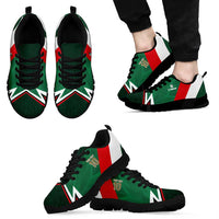 Mexico tricolor football sneakers on feet, green upper with red white stripes and black sole