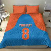 Blue and orange bedding set: duvet displays 'Your Text' and big 8, with two orange pillowcases