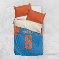 Blue and orange bedding set: duvet with 'Your Text' and number 8 design, 2 pillowcases