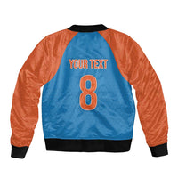 Blue bomber back with orange sleeves, black ribbed hem, YOUR TEXT and number 8 print