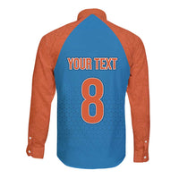 Long sleeve button shirt with blue back, orange sleeves, paisley pattern; number 8 on back