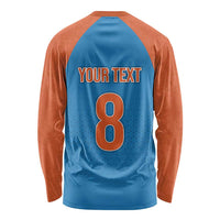 Long-sleeve raglan cricket shirt: blue back, orange sleeves, 'YOUR TEXT' and 8 number