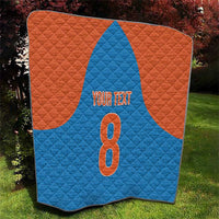 Orange and blue personalized quilt with a large number 8 and “YOUR TEXT”
