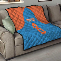 Personalized quilt draped on a sofa in blue and orange with number 8 and “YOUR TEXT”