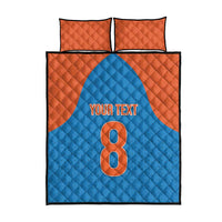 Custom quilt bed set flat view: blue quilt with orange “8” and “YOUR TEXT” center panel