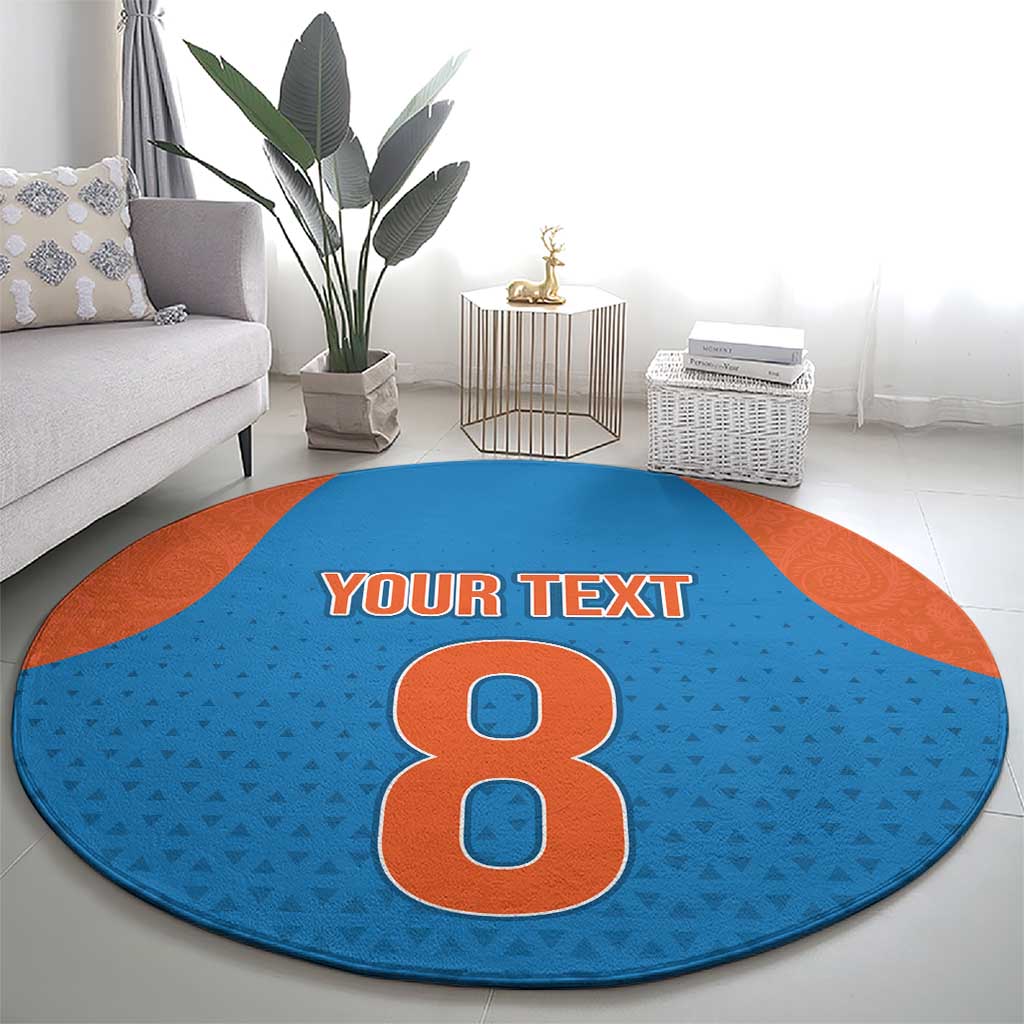 Round blue patterned carpet with orange edge, large number 8 and 'YOUR TEXT'