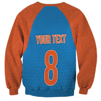 Unisex raglan sweatshirt with blue back panel, orange sleeves, Your Text 8 number print.