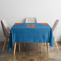 Blue tablecloth with orange center section and cricket-themed number design