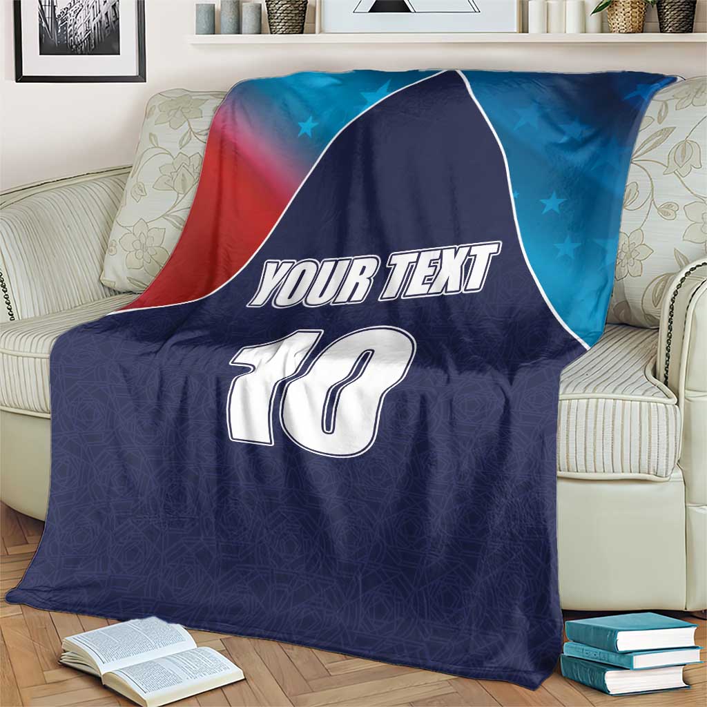 Personalized USA-style cricket blanket, navy blue with flag design, “YOUR TEXT” and number 10 over couch