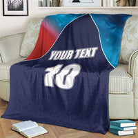Personalized USA-style cricket blanket, navy blue with flag design, “YOUR TEXT” and number 10 over couch