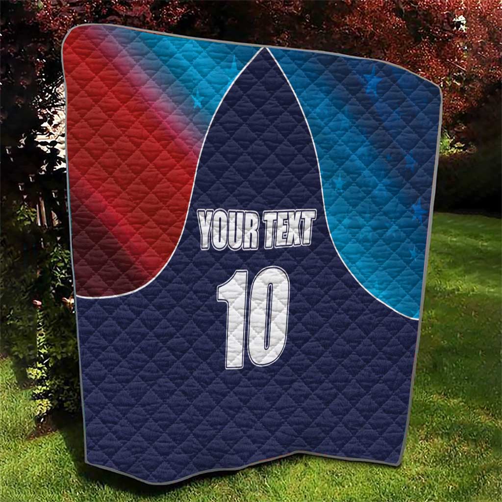 Quilted cricket quilt with navy base, red-to-blue curved panels, and number 10