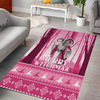 Pink Christmas area rug showing Merry Christmas, witch artwork, and white flying bats border