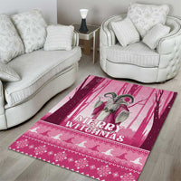 Pink Christmas area rug with Merry Christmas text and witch figure, centered pink stripe design