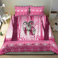 Pink “Merry Witchmas” witch bedding set on a bed with two matching square pillow shams