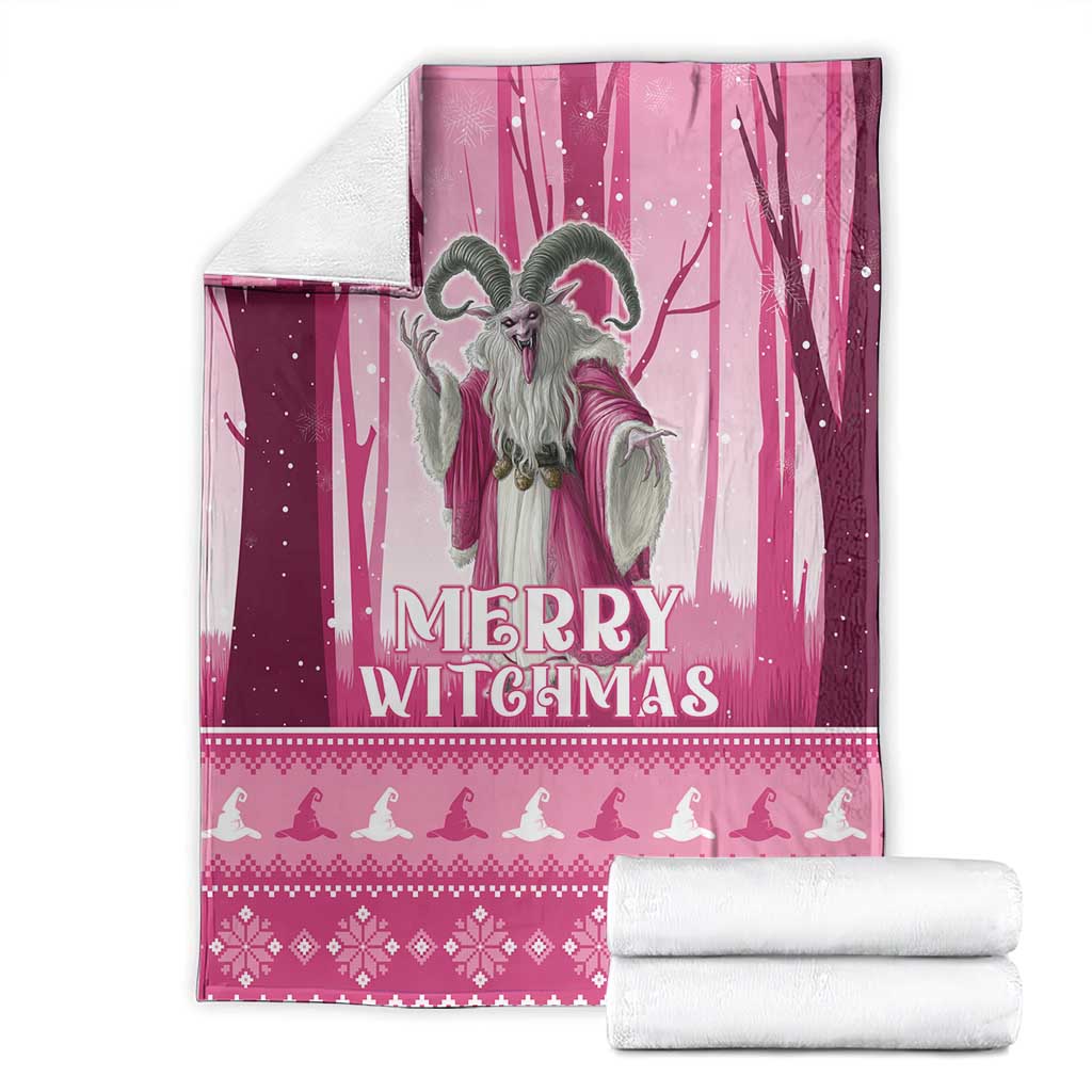 Pink Christmas witch blanket with witch illustration and 'Merry Witchmas' text, with folded rolls