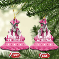 Pink bell-shaped ceramic witch ornament with loop and “Merry Witchmas” print