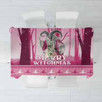Pink Christmas tablecloth with witch and “Merry Witchmas” graphic