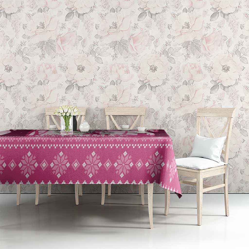 Pink witch-themed Christmas tablecloth with diamond pattern and bird ornaments