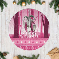 Pink round tree skirt with fringe, Merry Witchmas graphic with witch and moon