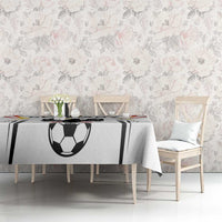 White football tablecloth with black soccer ball and striped panels, draped on table