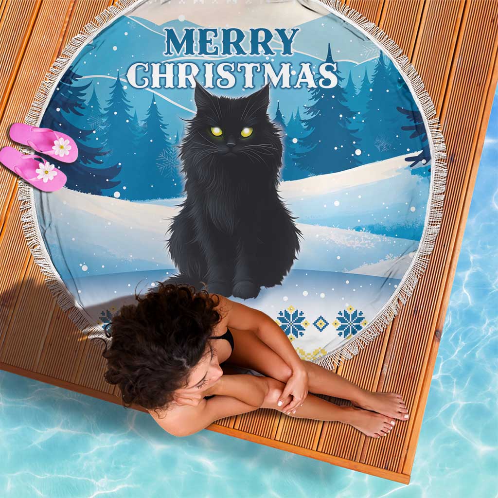 Blue round beach blanket with black cat and Merry Christmas text, fringed edge; woman holding