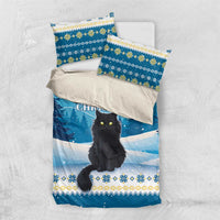 Blue cat bedding set with duvet cover and two coordinating pillowcases on light fabric backdrop