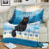 Blue cat Christmas throw blanket draped on sofa, 'MERRY CHRISTMAS' and snow forest