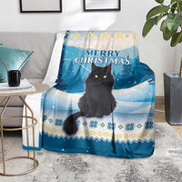 Blue cat Christmas throw blanket on living room floor, 'MERRY CHRISTMAS' snowy scene