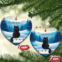 Blue heart-shaped ceramic cat ornaments with “Merry Christmas” and “Yule Cat” text