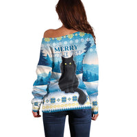 Women's off-shoulder blue sweater with back cat graphic and 'Merry Yule Cat'