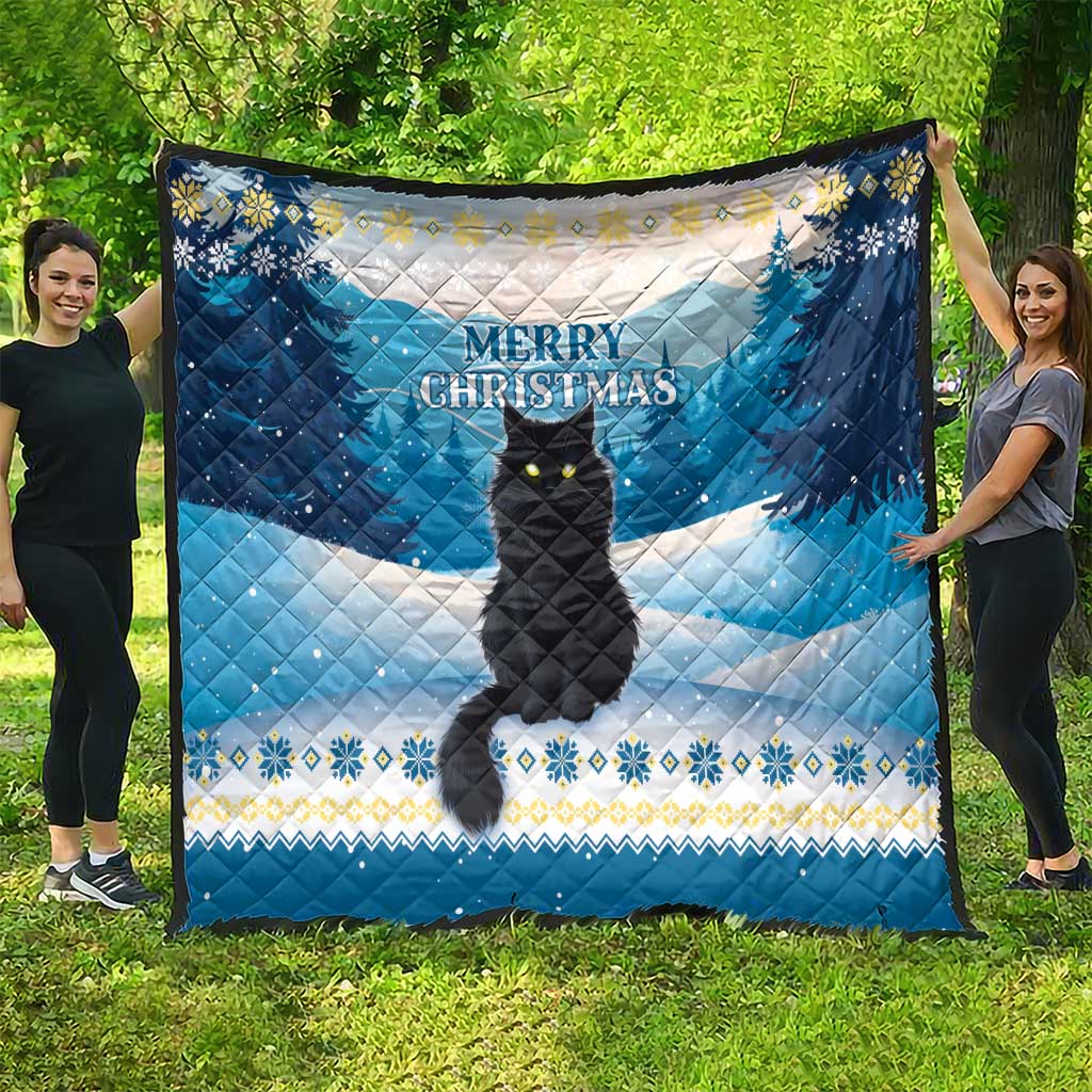 Blue quilt showing a black cat silhouette with “Merry Christmas” over snowy landscape