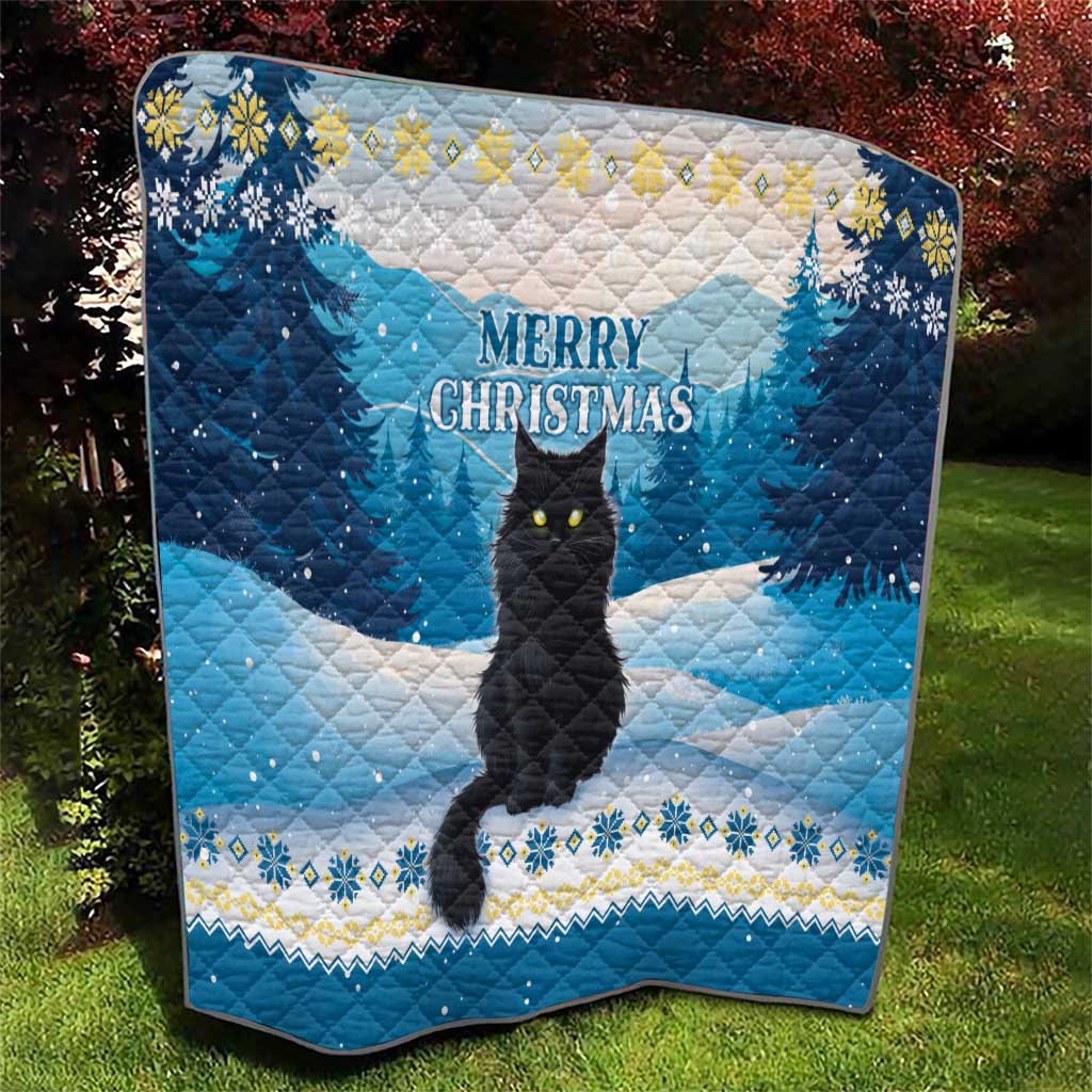 Blue quilt with black cat centered in snowy trees, “Merry Christmas” lettering