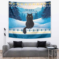 Blue winter cat tapestry with snowy trees and “Merry Christmas” lettering