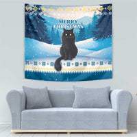 Blue winter cat tapestry with snowy pine border and “Merry Christmas” lettering