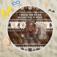 Brown round Christmas beach blanket with fringe edge, Belsnickel graphic and 'Cheer or Fear' text