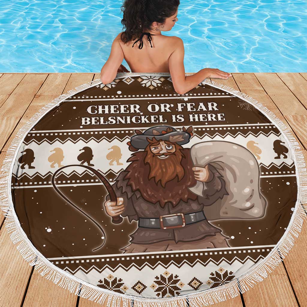 Brown round Christmas beach blanket with white fringe trim and Belsnickel character illustration