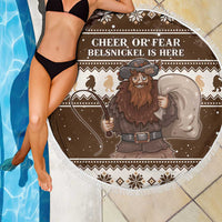 Brown round beach blanket with white fringe edge, Belsnickel graphic and holiday patterned border