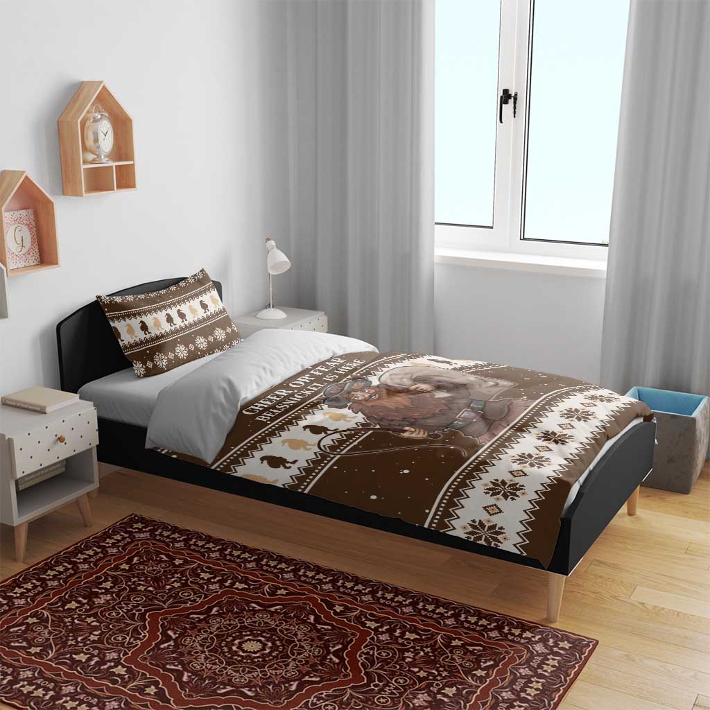 Brown and beige Christmas bedding set on a bed with Belsnickel graphic and patterned trim