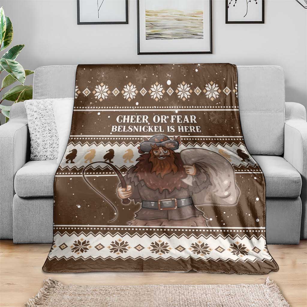 Brown Christmas Belsnickel throw blanket on sofa with 'CHEER OR FEAR' lettering