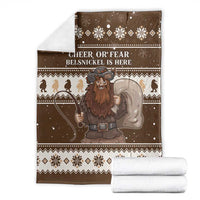 Brown Christmas Belsnickel blanket with folded white towels; 'CHEER OR FEAR' text
