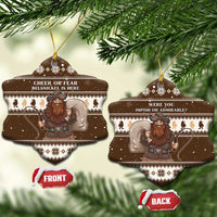 Brown ceramic bell-shaped Belsnickel ornaments hanging, front and back text visible.