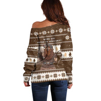 Brown off-shoulder Christmas sweater, back view, fair isle pattern and playful character art