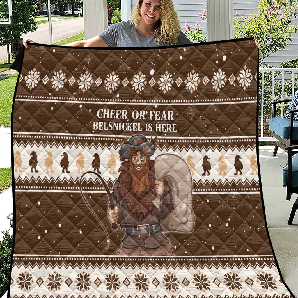 Brown Christmas quilt with geometric borders, snowflake motifs, and a Belsnickel graphic