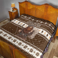 Brown holiday quilt on a bed with “CHEER OR FEAR” text and Belsnickel character print