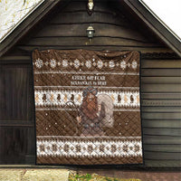 Brown Christmas quilt hanging outdoors with diamond quilting, “CHEER OR FEAR” and Belsnickel